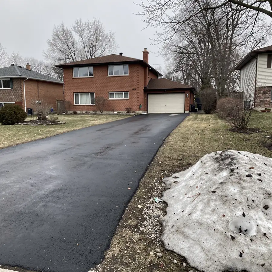 Asphalt driveway after first Kitchener winter
