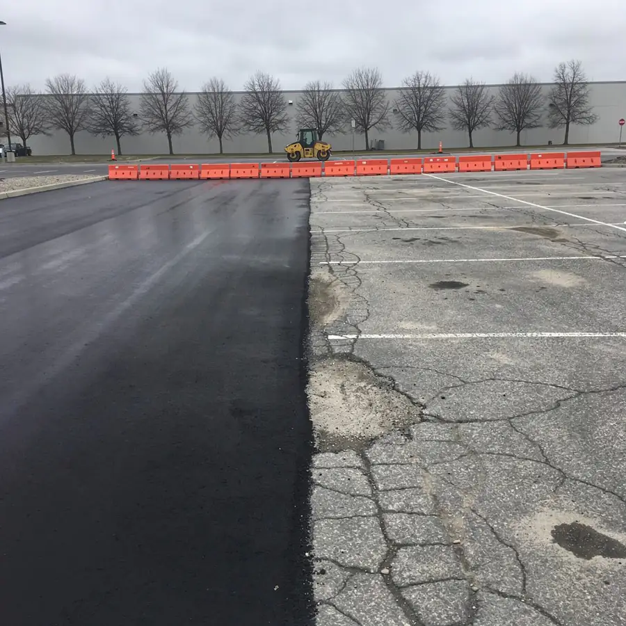 Half-repaved plaza lot with open section