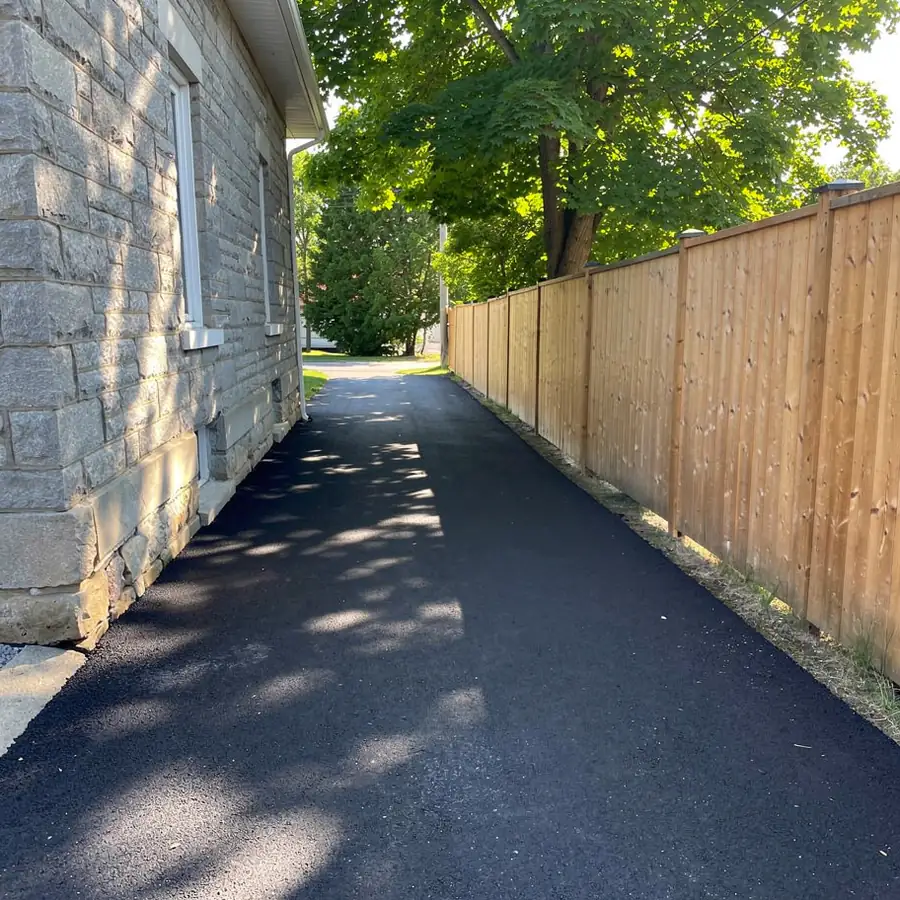 Narrow side driveway beside Galt stone home