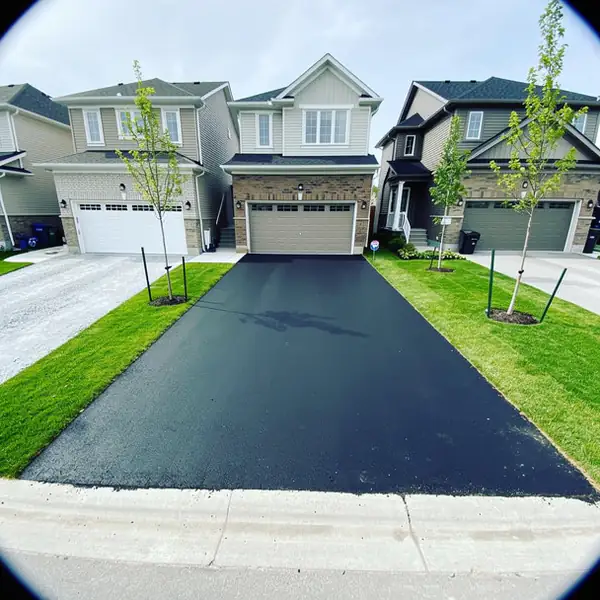 New subdivision driveway with asphalt top coat