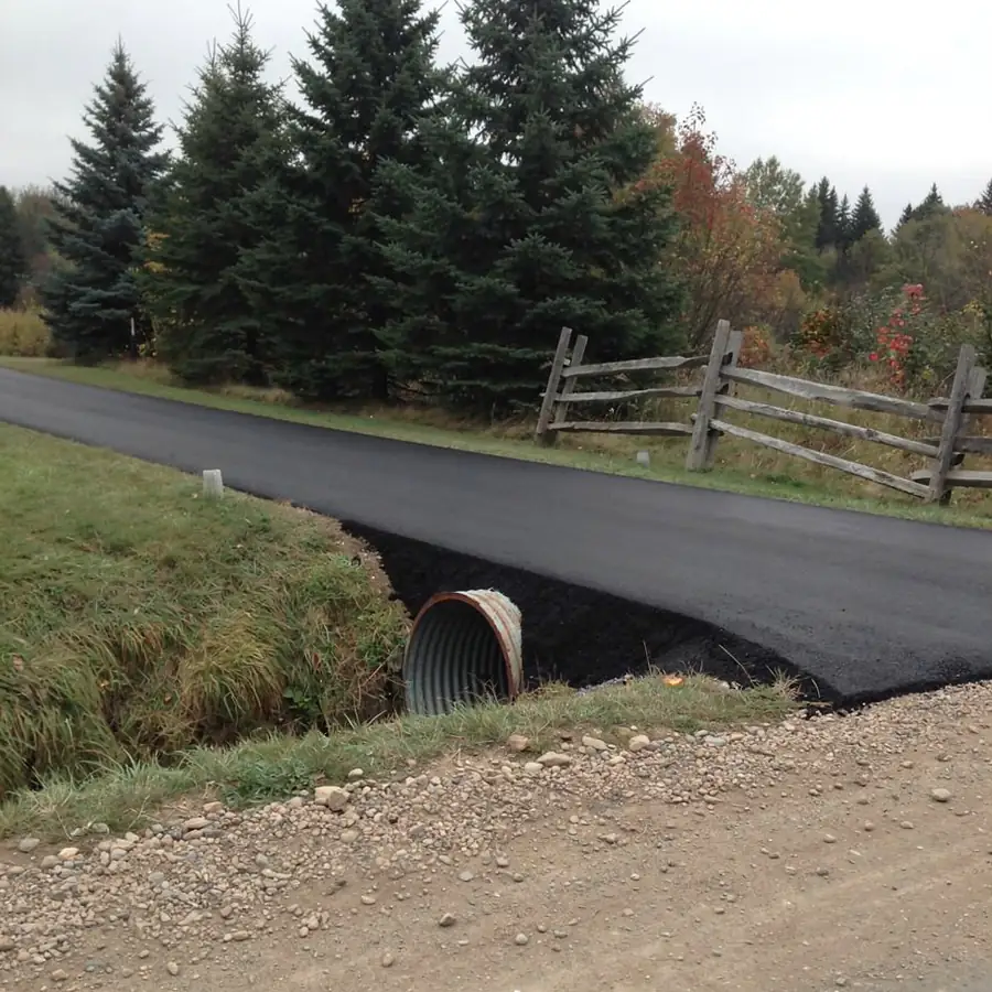 Paved rural lane with culvert near Aberfoyle