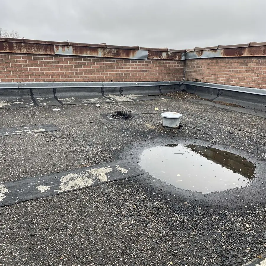 Ponding water on worn gravel roof