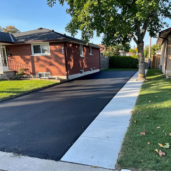 Single car asphalt driveway Stanley Park bungalow