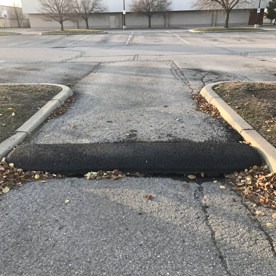 Tapered asphalt speed bump in plaza lot